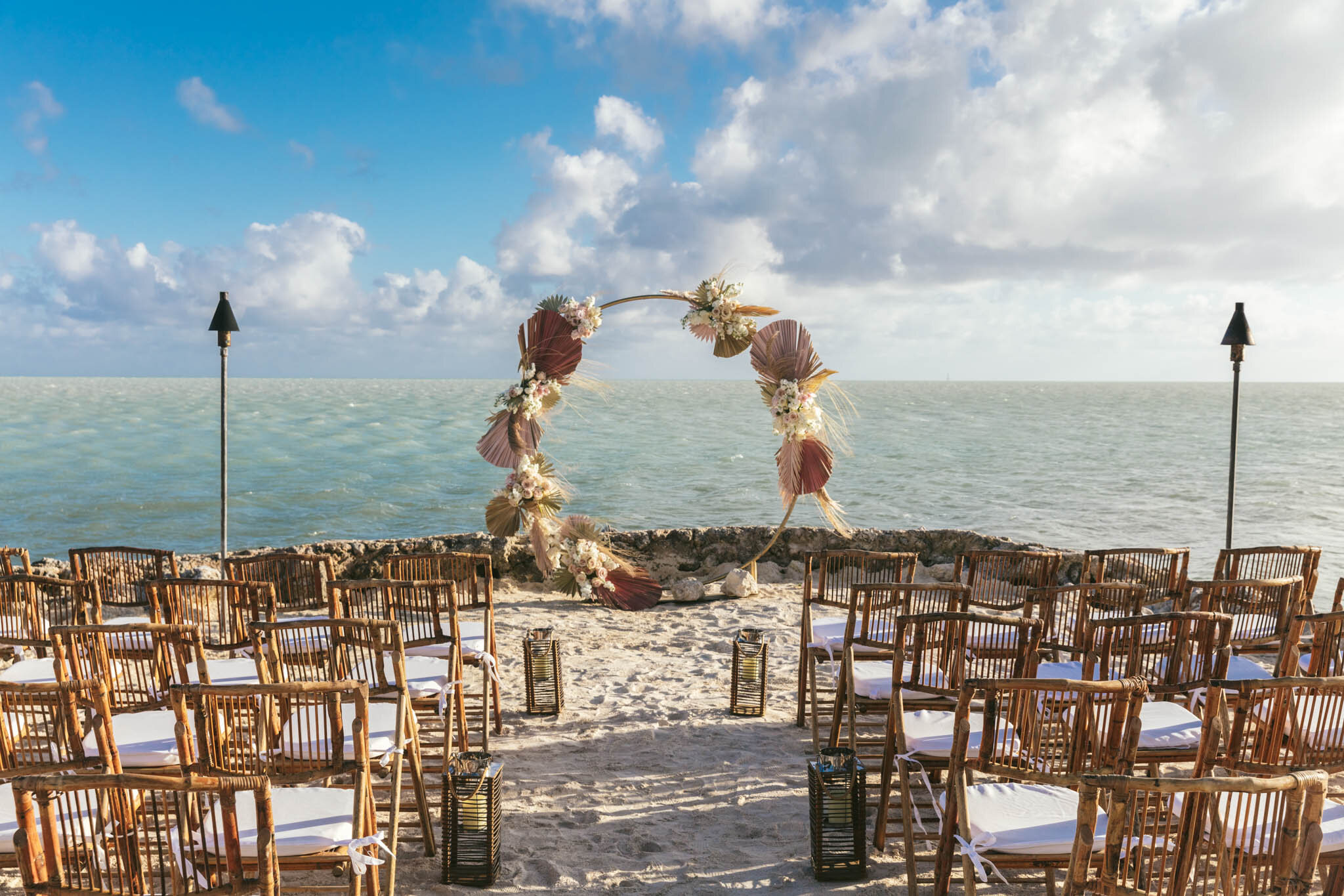  Wedding arch and seats set up on The Islands of Islamorada’s private jetty looking out onto the crystal clear waters of the Atlantic Ocean. 
