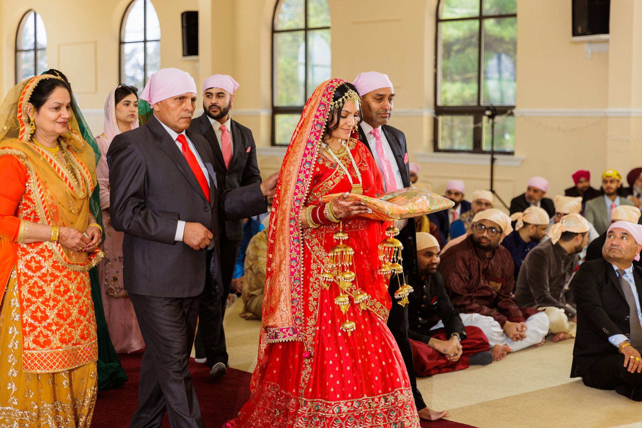 Sikh Bride entering Gurudwara with her family mebers