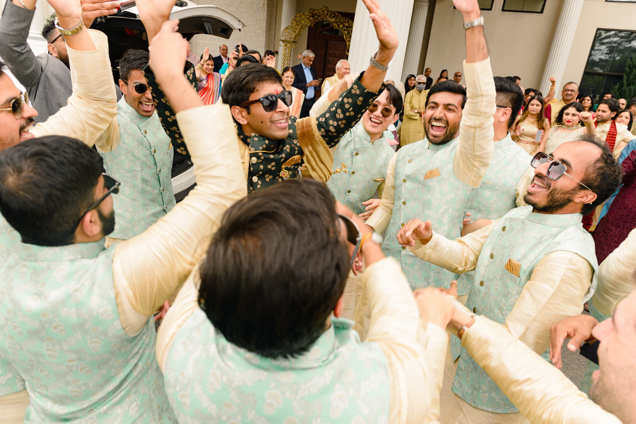 Indian Baraat tradition photos grooms men dancing