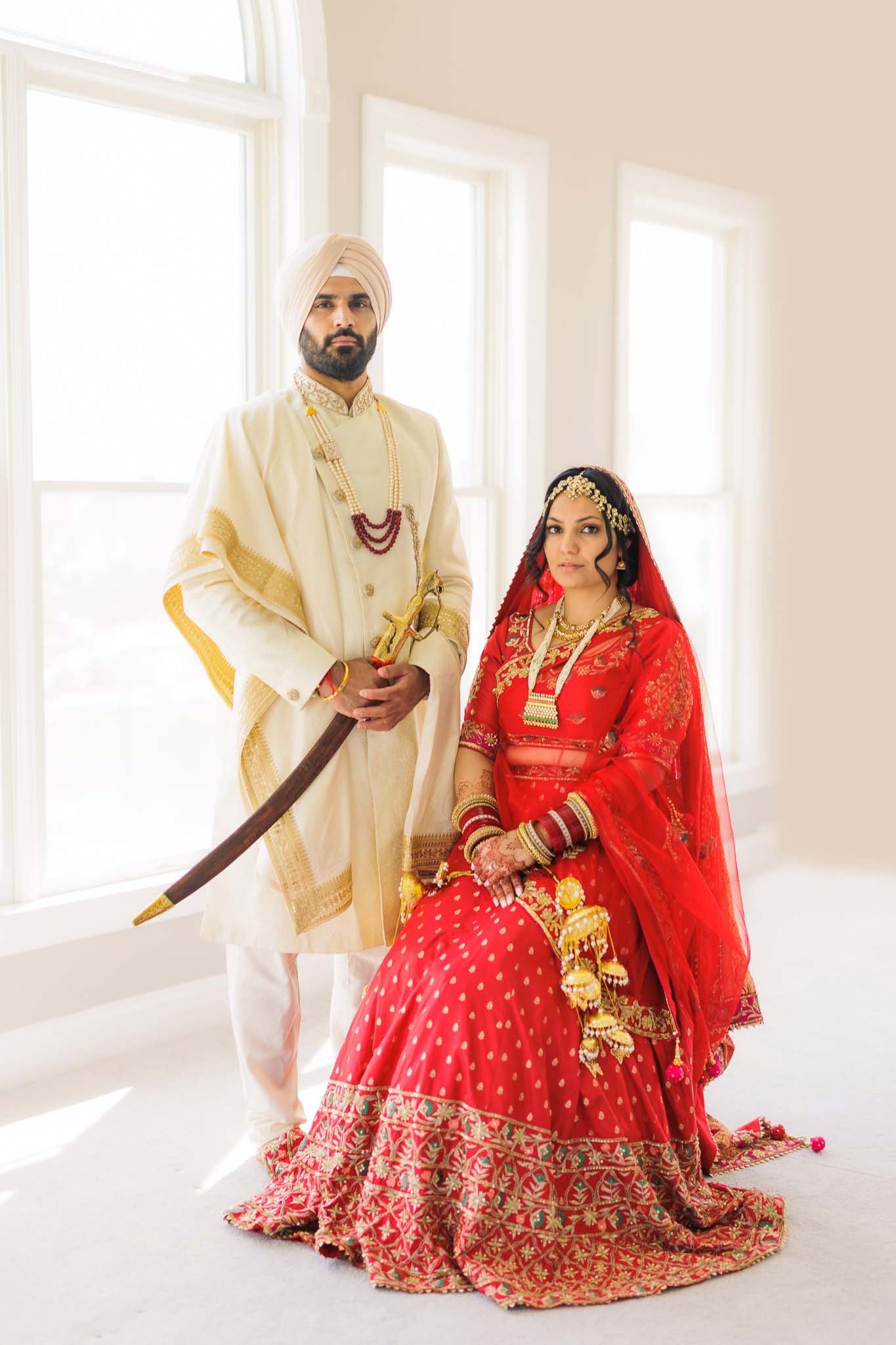 A Punjabi Bride and Groom in their traditional outfit on their wedding day