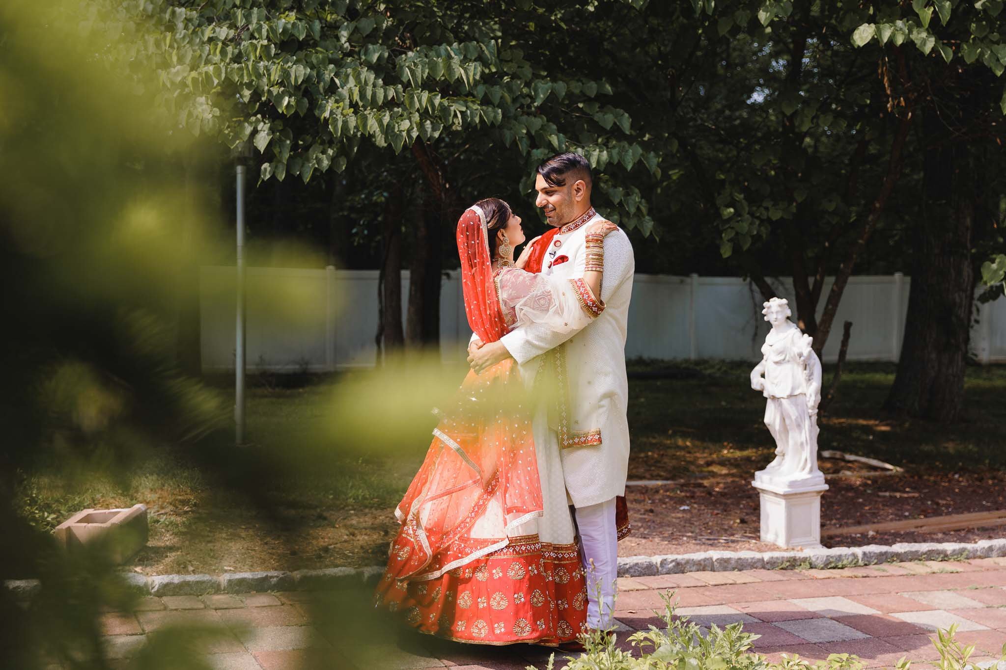  Artistic portrait on sunny day of Indian bride and groom 