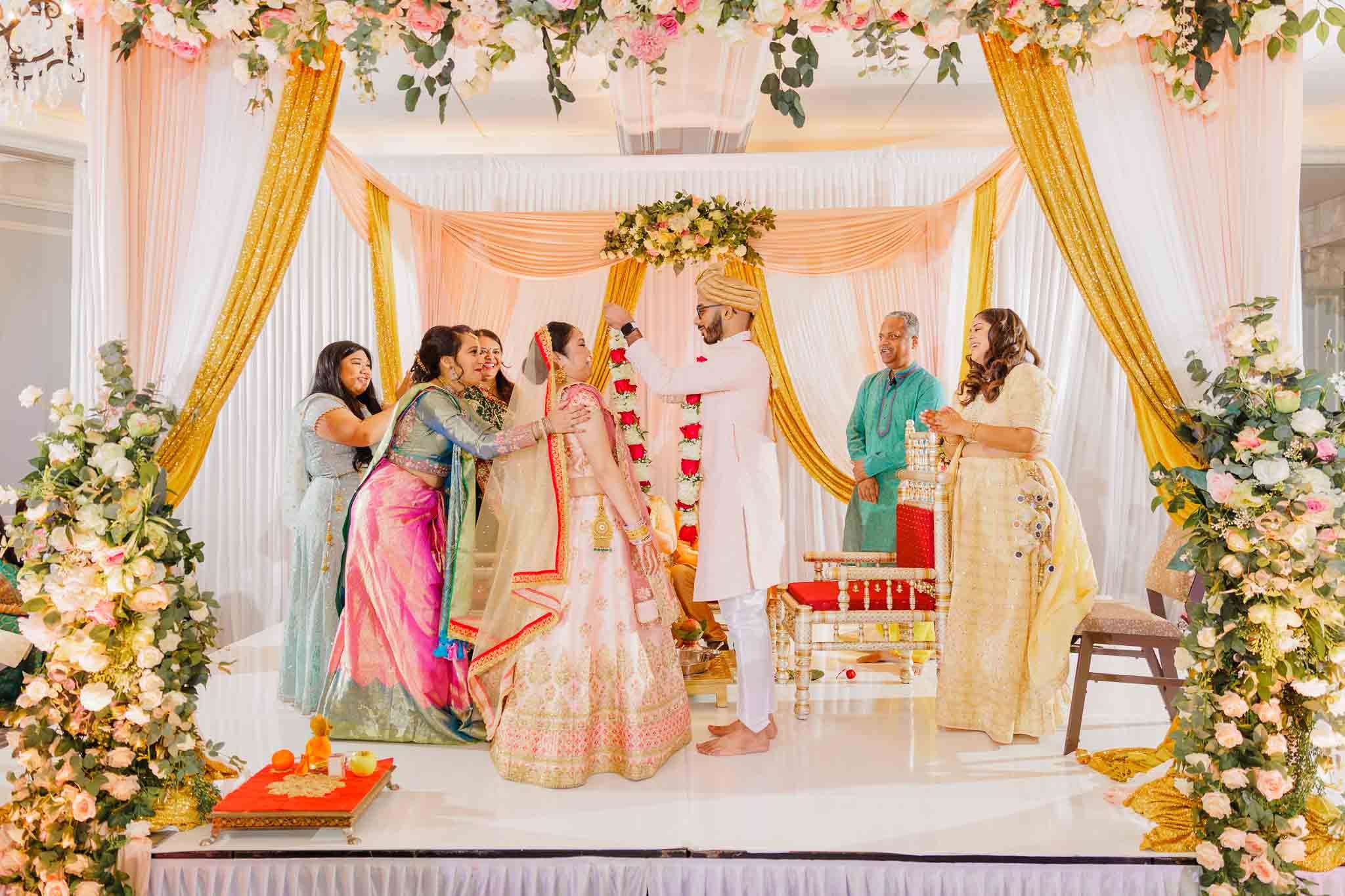 Indian couple exchanging the garlands photo