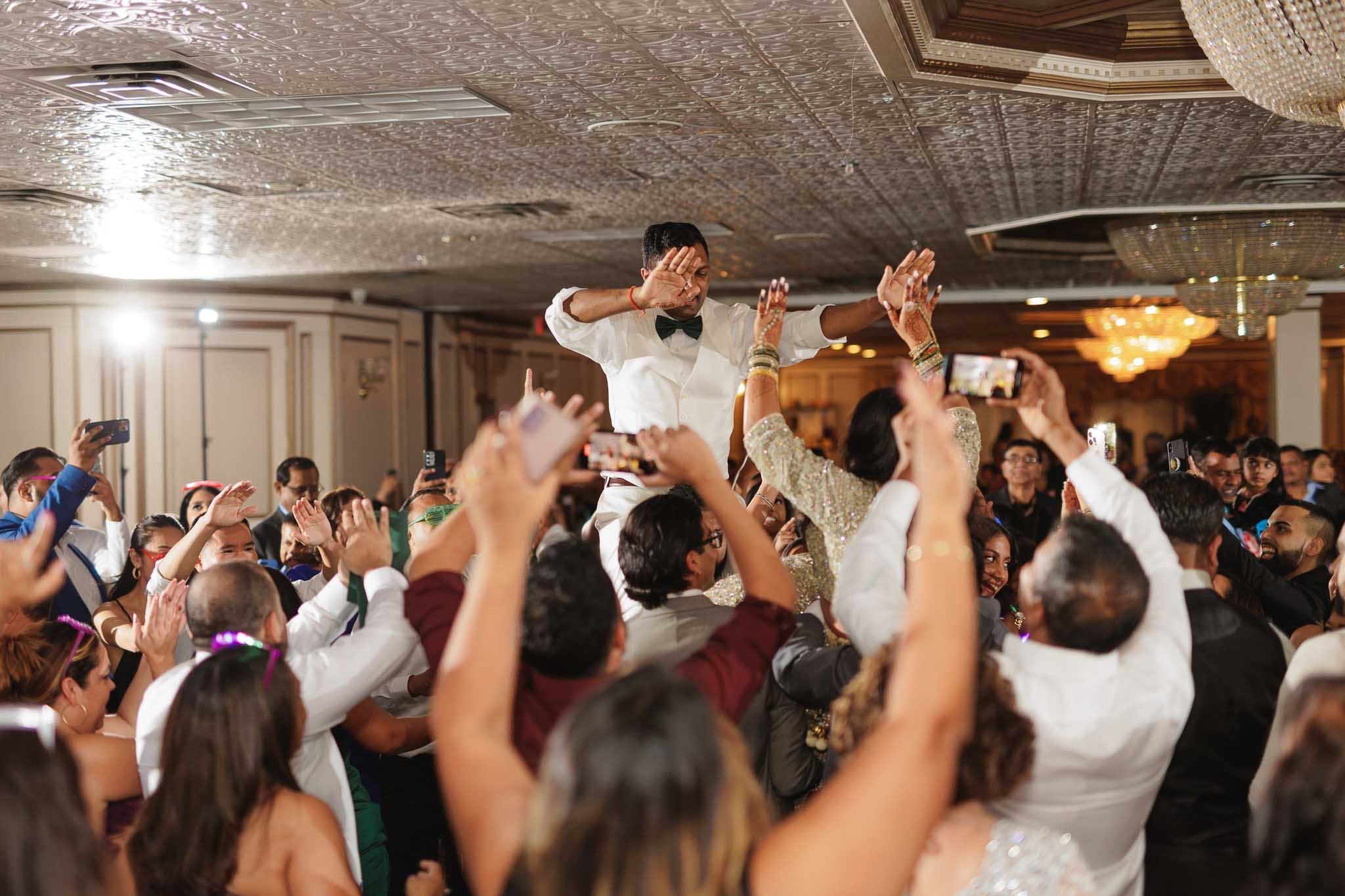 wedding guest lift groom dancing