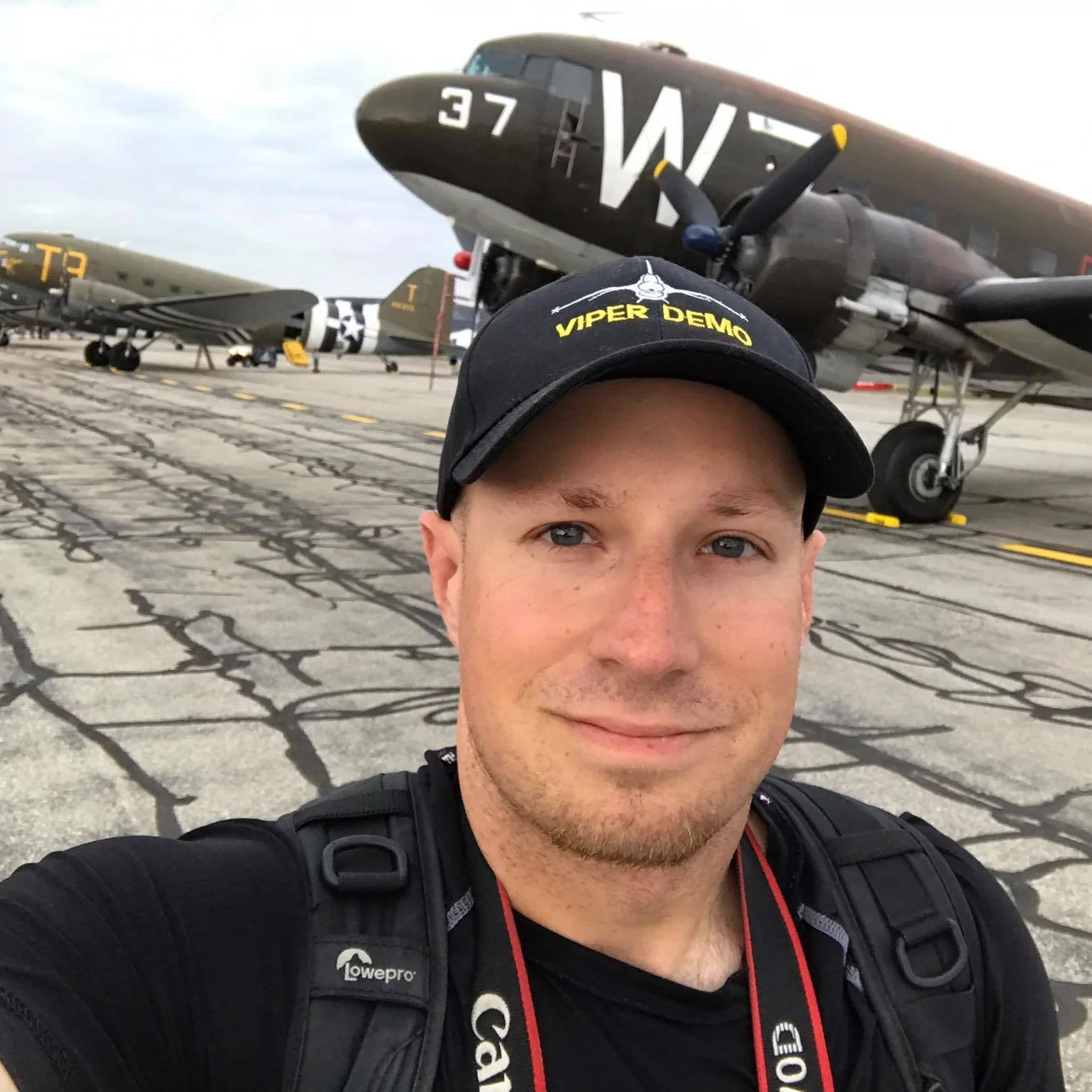 Ryan Tykosh Photographer Every burning passion starts with but a tiny spark. For myself, that spark ignited a flame at the age of three. There I stood, gazing skyward outside my childhood home in awe of six red white and blue aircraft with a large bird emblem gracing the underside of each. Full Bio...