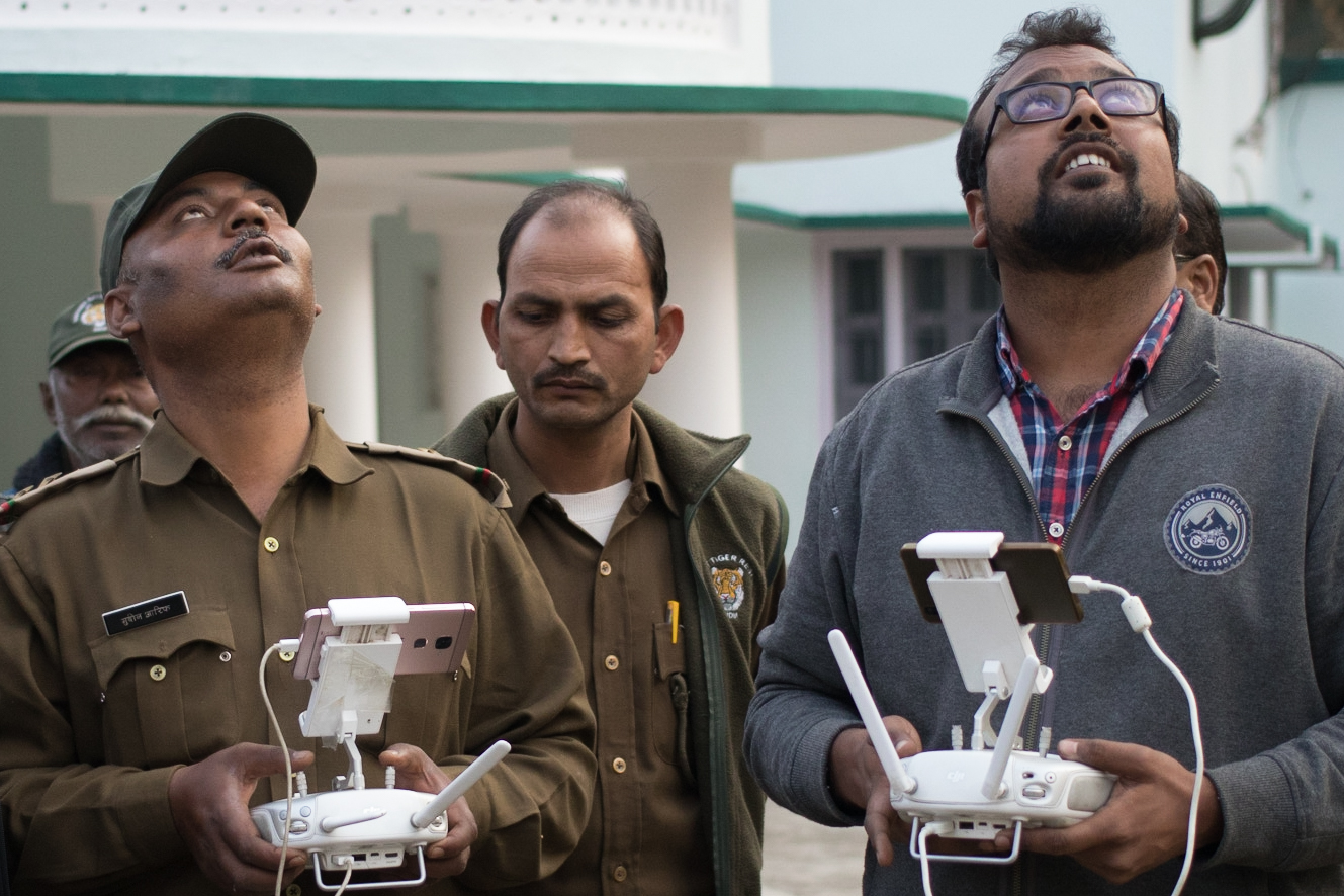 Ayush Gupta teaching a Forest Department staff member how to fly a UAV.