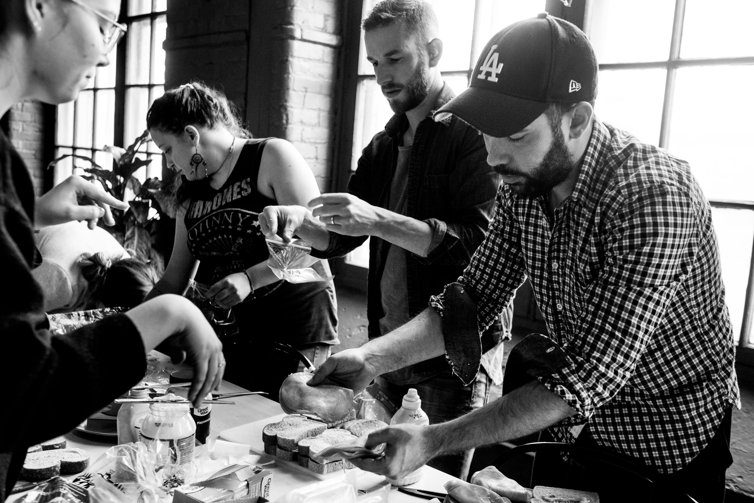 Molly, Mandy, Daniel and Adrian working the sandwich assembly line.