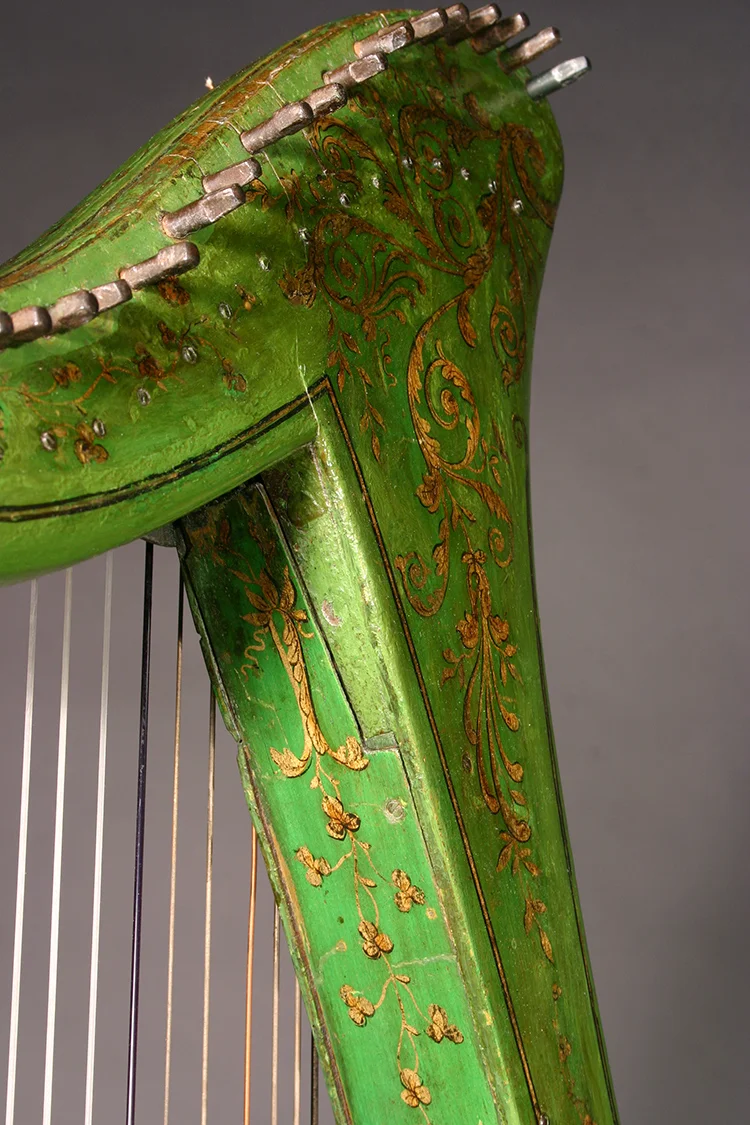 Historic John Egan harp with green and gold polychrome surface decoration