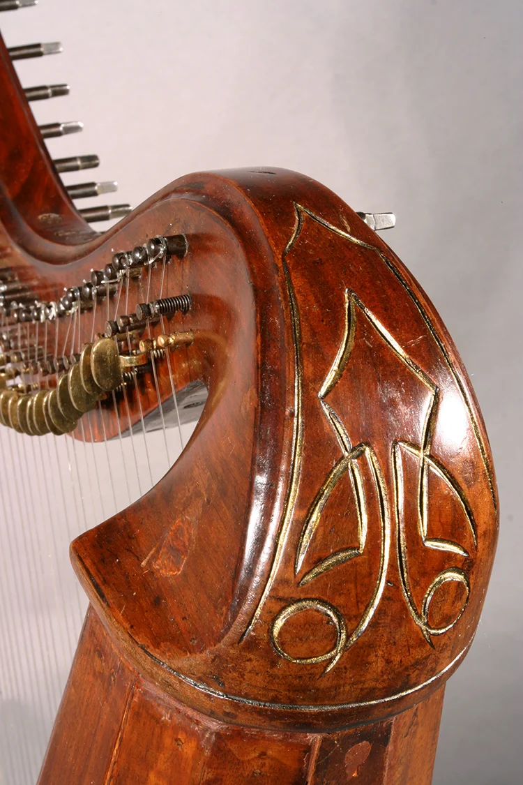 Detail of Irish harp with Celtic inspired engravings