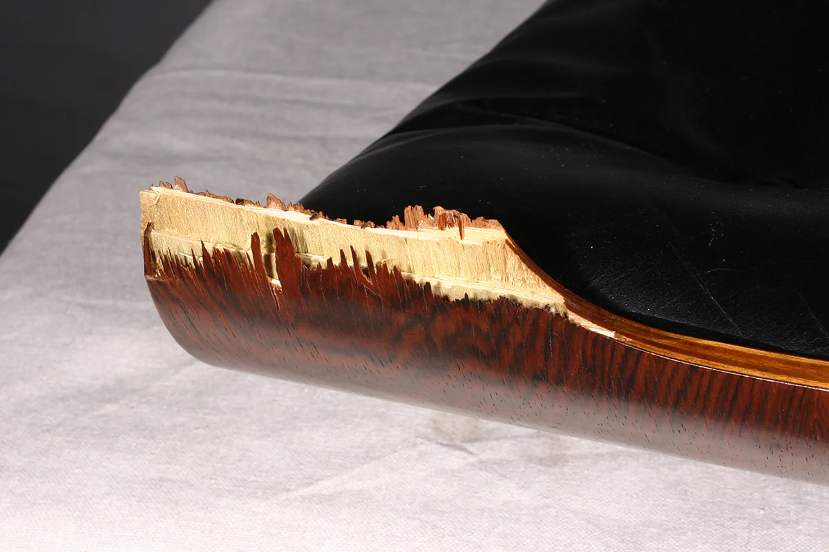 Damage to Eames chair bent plywood component