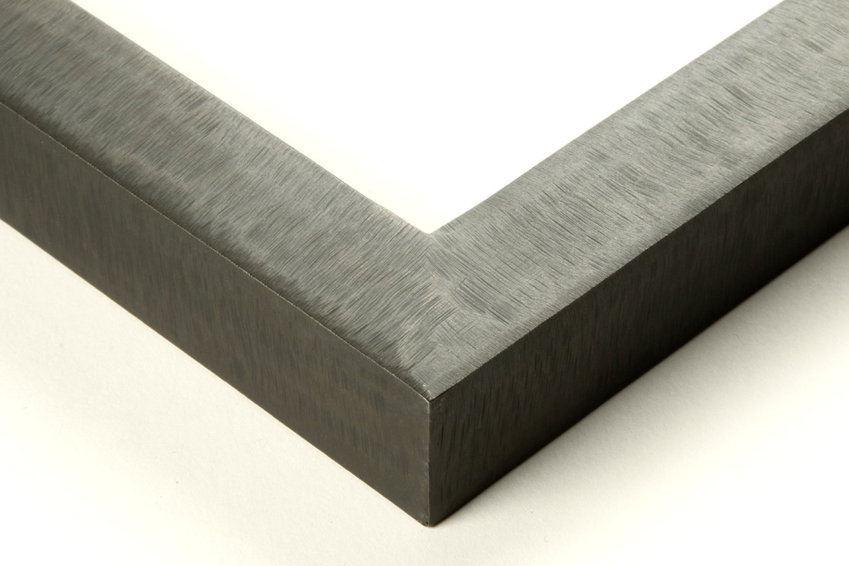 Detail of an 1” wide molding steel frame with hammered blue finish