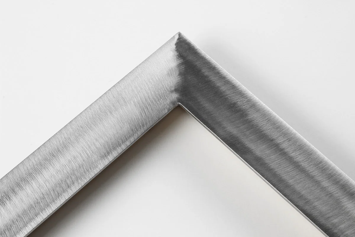 Detail of an 1.5” wide molding steel frame with etched gloss finish