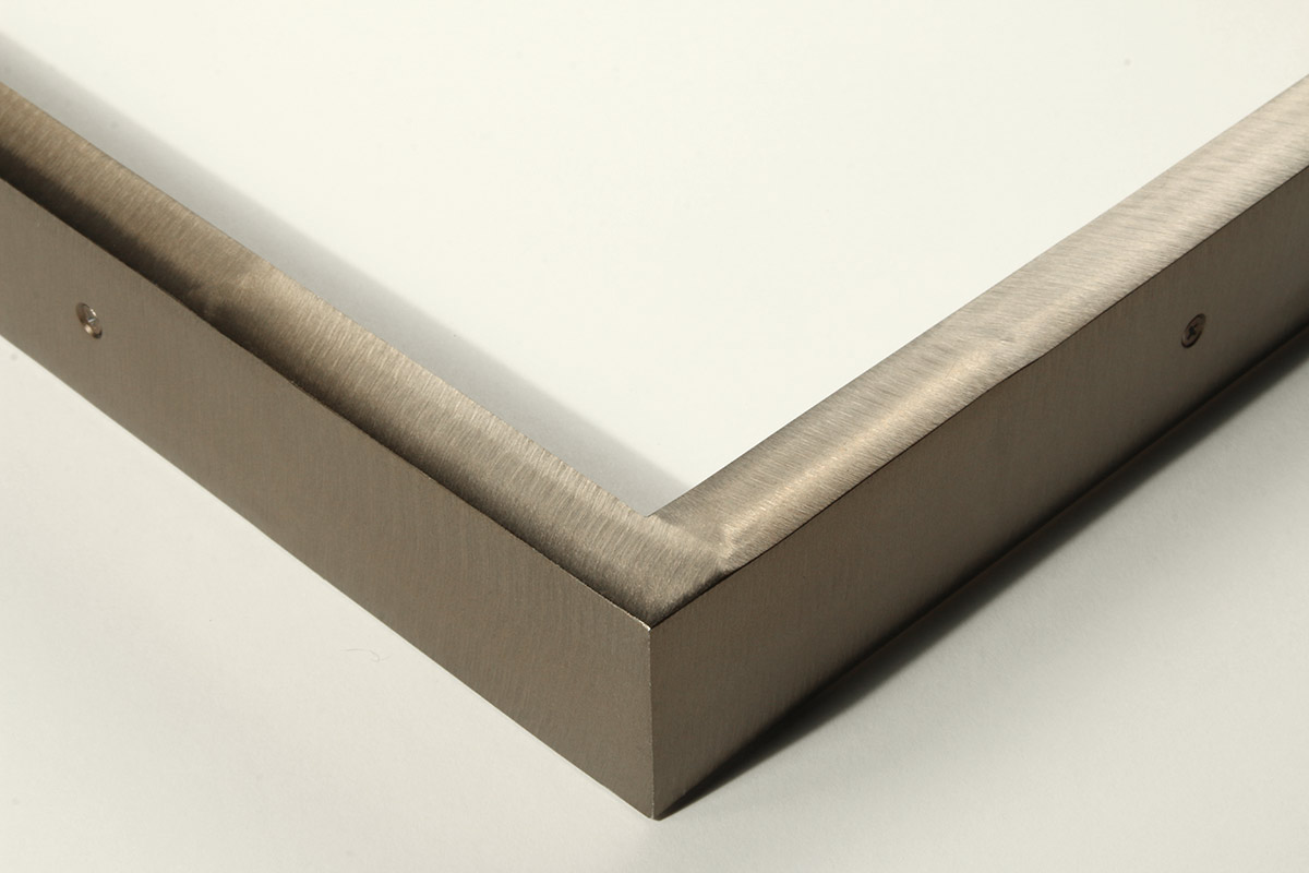 Detail of a 5/8” wide molding steel frame with zirconia bronze finish