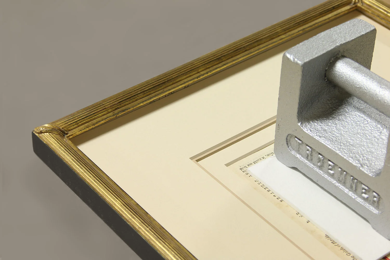 Traditional reeded profile with corner straps prepared to host a small 19th century map which is in the process of hinging.