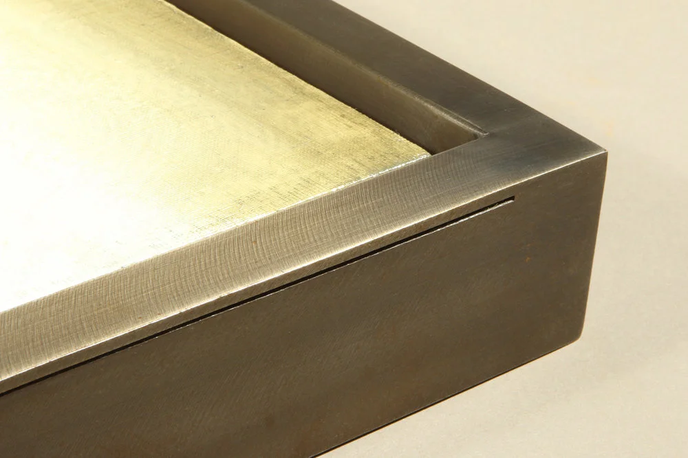 This sophisticated custom welded float frame features an elegant thin groove that contrasts with edge thickness and stops at the seamless corner creating the sense of visual relief.