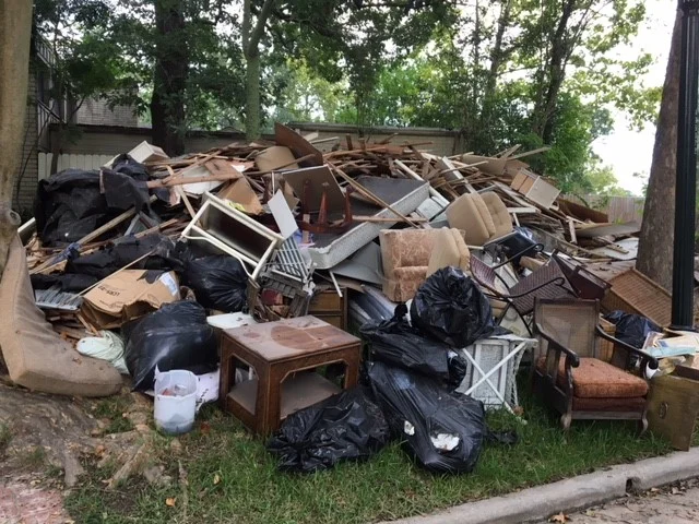 …we all moved everything to the front yard. The pile of belongings in the front yard grew with each day…