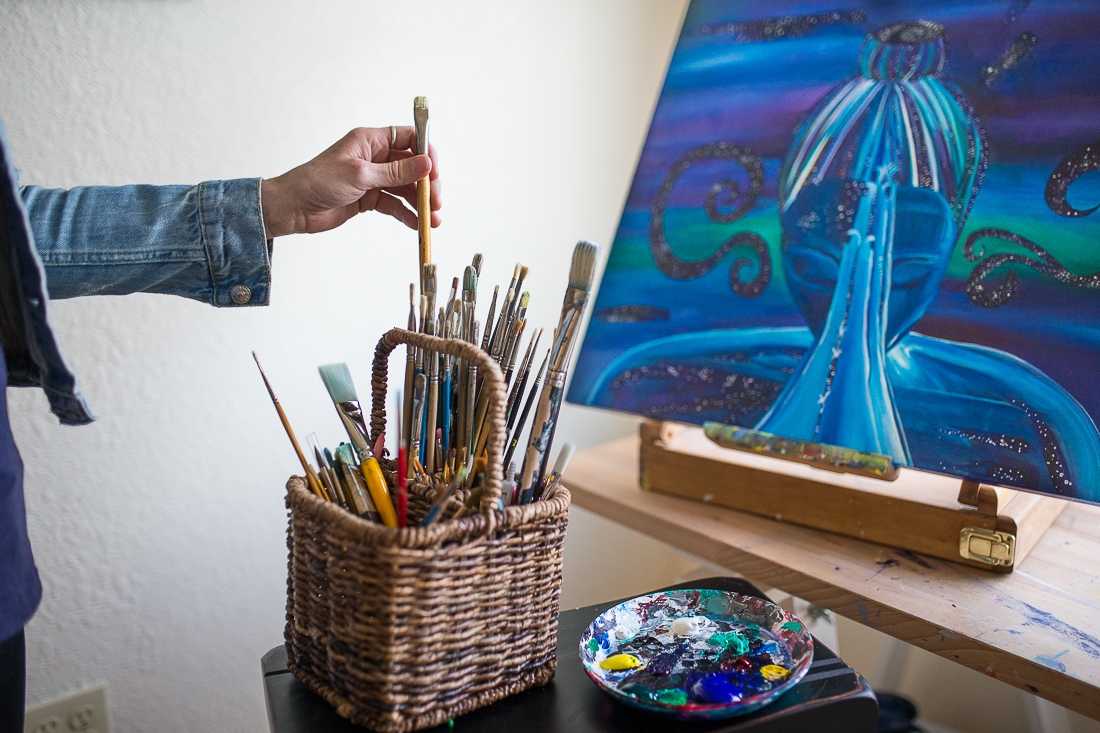 So many choices! Here I am, choosing a brush in my studio.