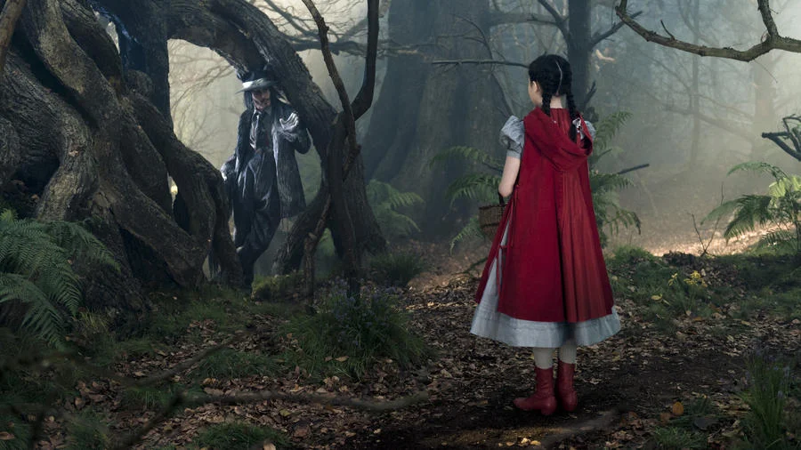 Lilla Crawford's Little Red Riding Hood encounters Johnny Depp's Wolf in "Into the Woods." (photo credit: Peter Mountain / Disney)