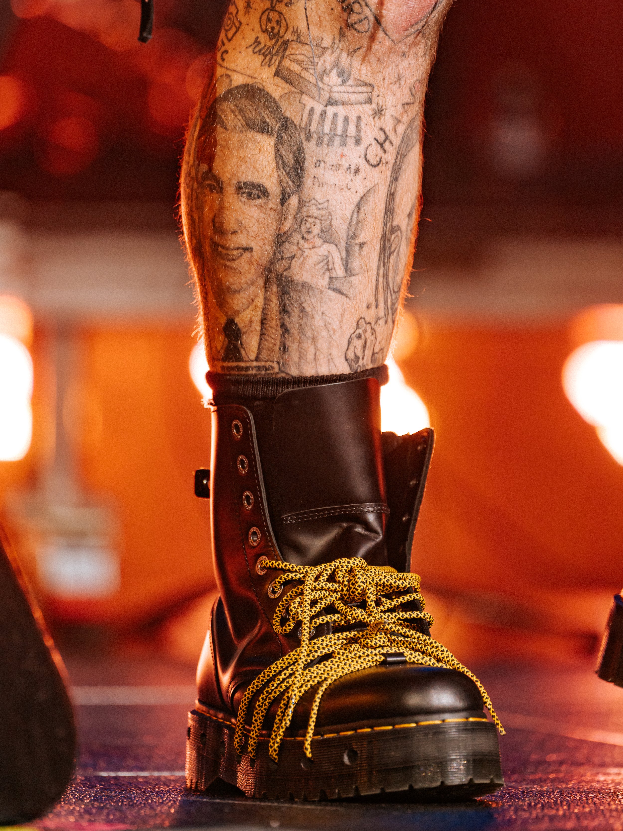 Teddy Swims' tattoos and boots on stage at Madden Bowl