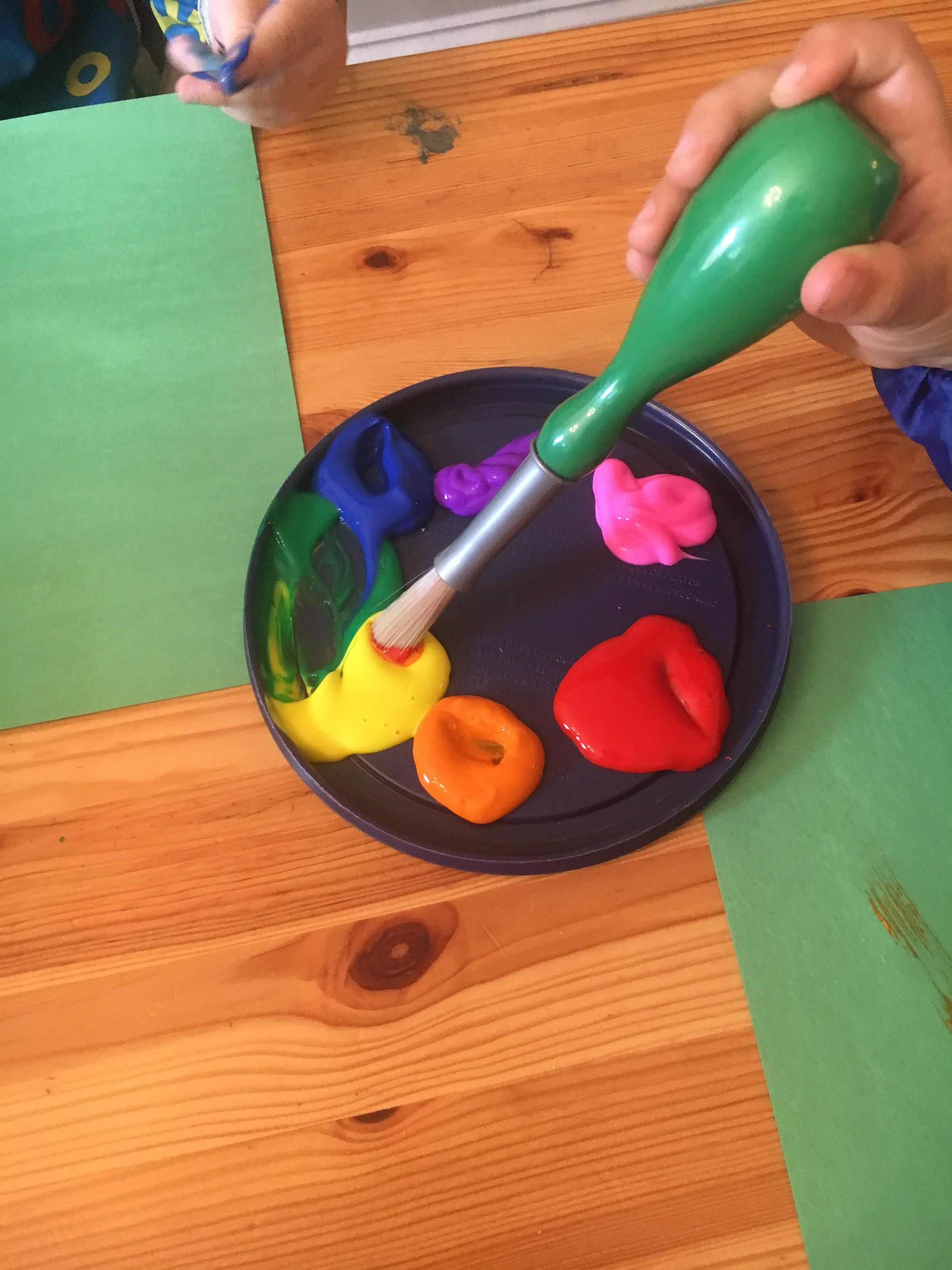Image: a palette of rainbow paint