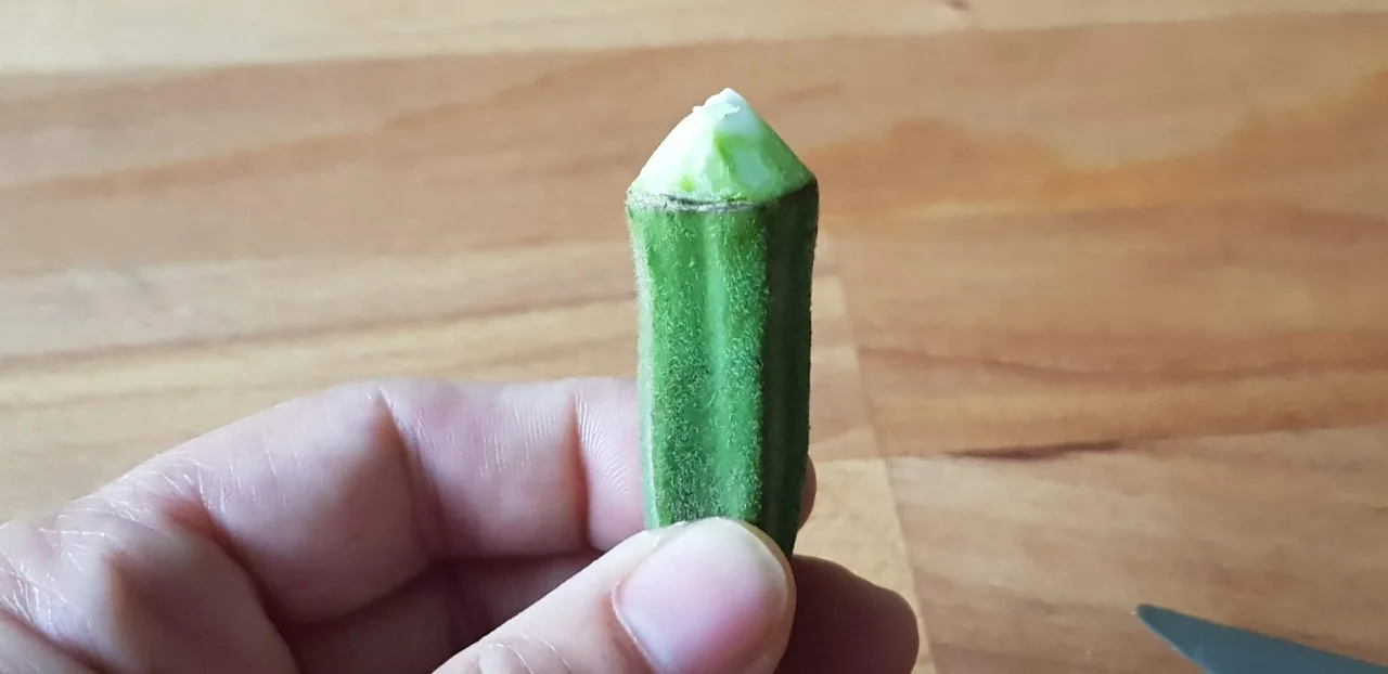 thumbnail_Cutting the tip of Okra.jpg