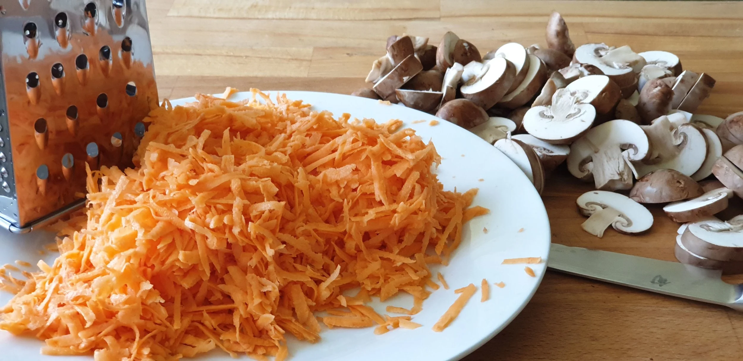 Shredding sweet potato and slicing mushroom.jpg