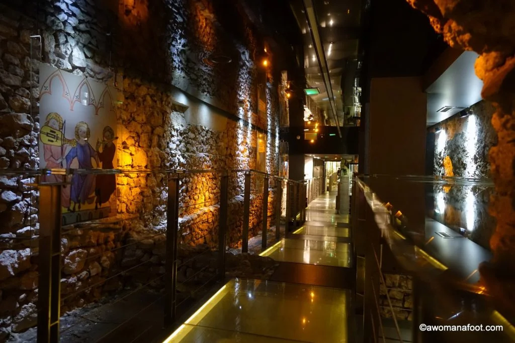 Krakow's Underground Museum: a true hidden gem that you must put on your Krakow's itinerary! Discover 1000 years of Krakow's history unearthed by archaeologists just a few years ago! A must-see for all history buffs and culture travelers! Learn more about the museum @ awomanafoot.com | What to do in Krakow | Krakow off the beaten path | Archaeological Museum | Main Square in Krakow | #Krakow #Museum #Archaeology #Travel #UniqueDestination #MiddleAges #Europe