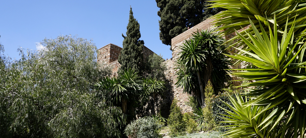 Málaga's history spans almost three millennia. We can still see marvelous signs of the old history - Roman theater, Medieval Muslim #Alcazaba and #Gibralfaro - military base from the times of the Catholic kings. See why those places are a must for any visitor to Málaga @ AWOMANAFOOT.COM! What to see in #Málaga | Best #travel #destinations in Spain | #Spain for history buffs | #Must-see in Málaga.
