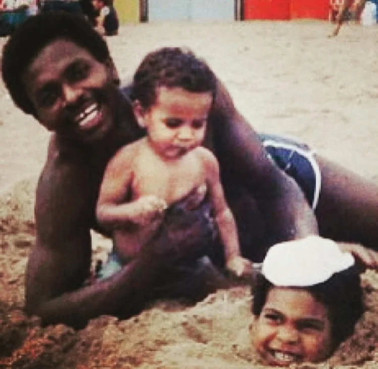 On the beach with dad Deron and brother James circa 1985
