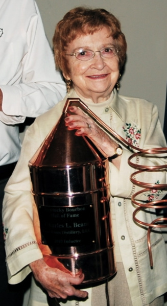 Mary Lee Kuhn Beam accepts the honor and Trophy for her husband Charles L. Beam to be inducted into the Bourbon Hall of Fame in 2010. Photo provided by the Kentucky Bourbon Hall of Fame