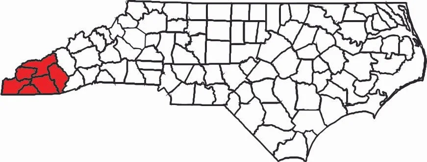 Map of North Carolina with counties outlined, and the westernmost counties shaded in red.