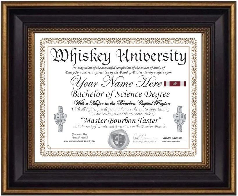 Diploma from Whiskey University awarded to an individual for completing a Bachelor of Science degree with a major in the Bourbon Capital Region, granting the title 'Master Bourbon Taster', signed by Brian Grooms, with decorative borders and framed display.