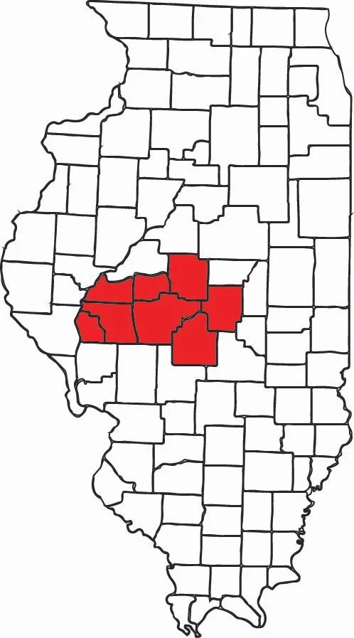 Map of Illinois with several counties in the central region highlighted in red.