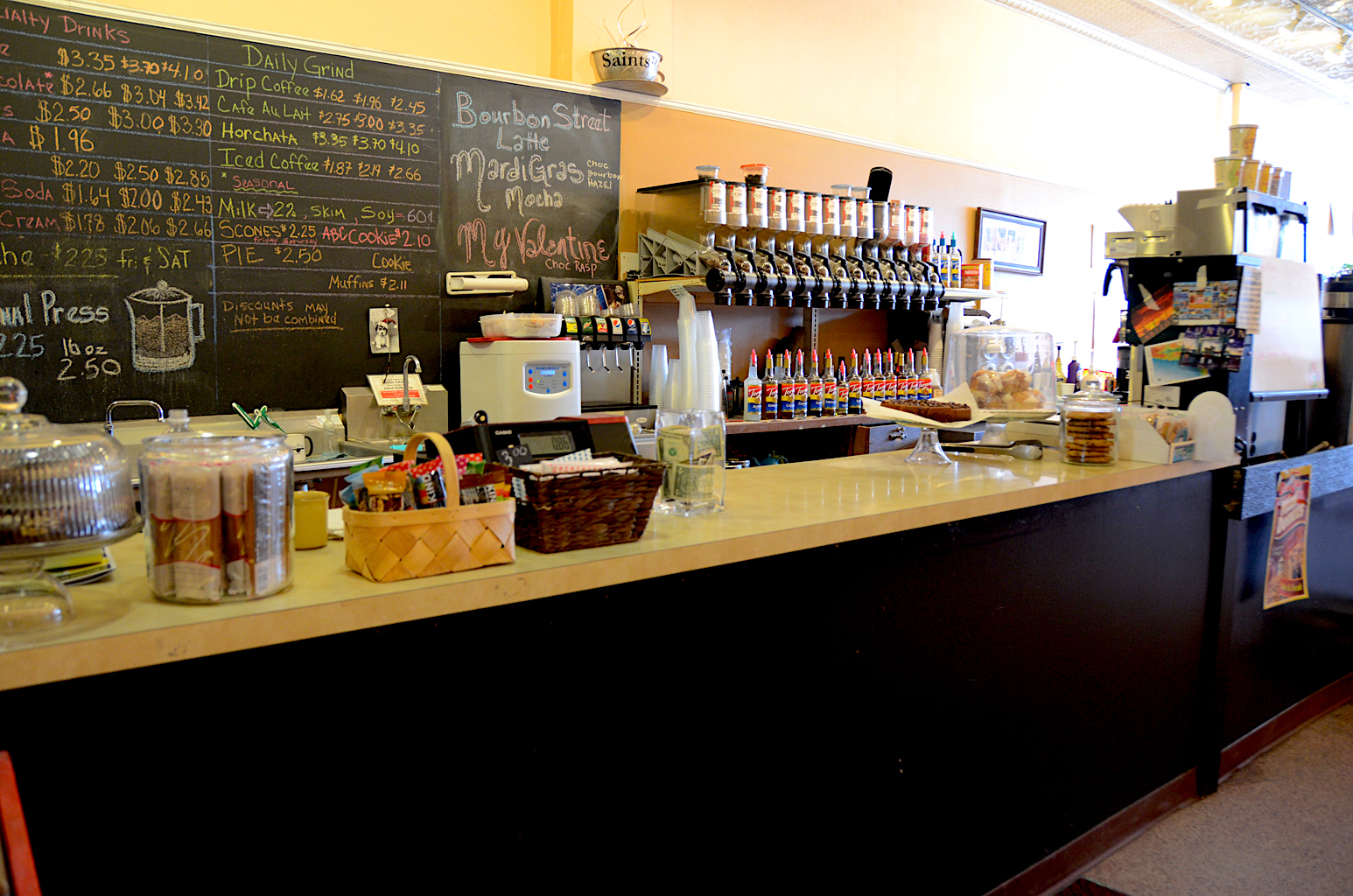 welcoming counter with bulk coffee beans and bakery menu.JPG