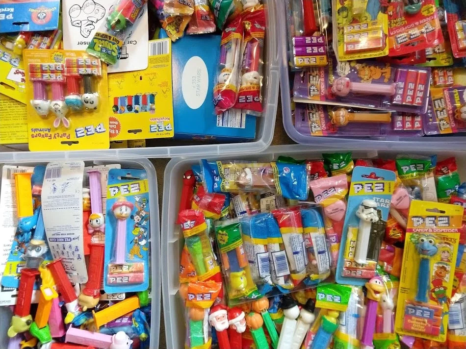 Some of the chaos that is my own collection. PEZ collectors don't seem to care if the dispenser is still in its original packaging, but I play it safe. That candy must be disgusting by now.
