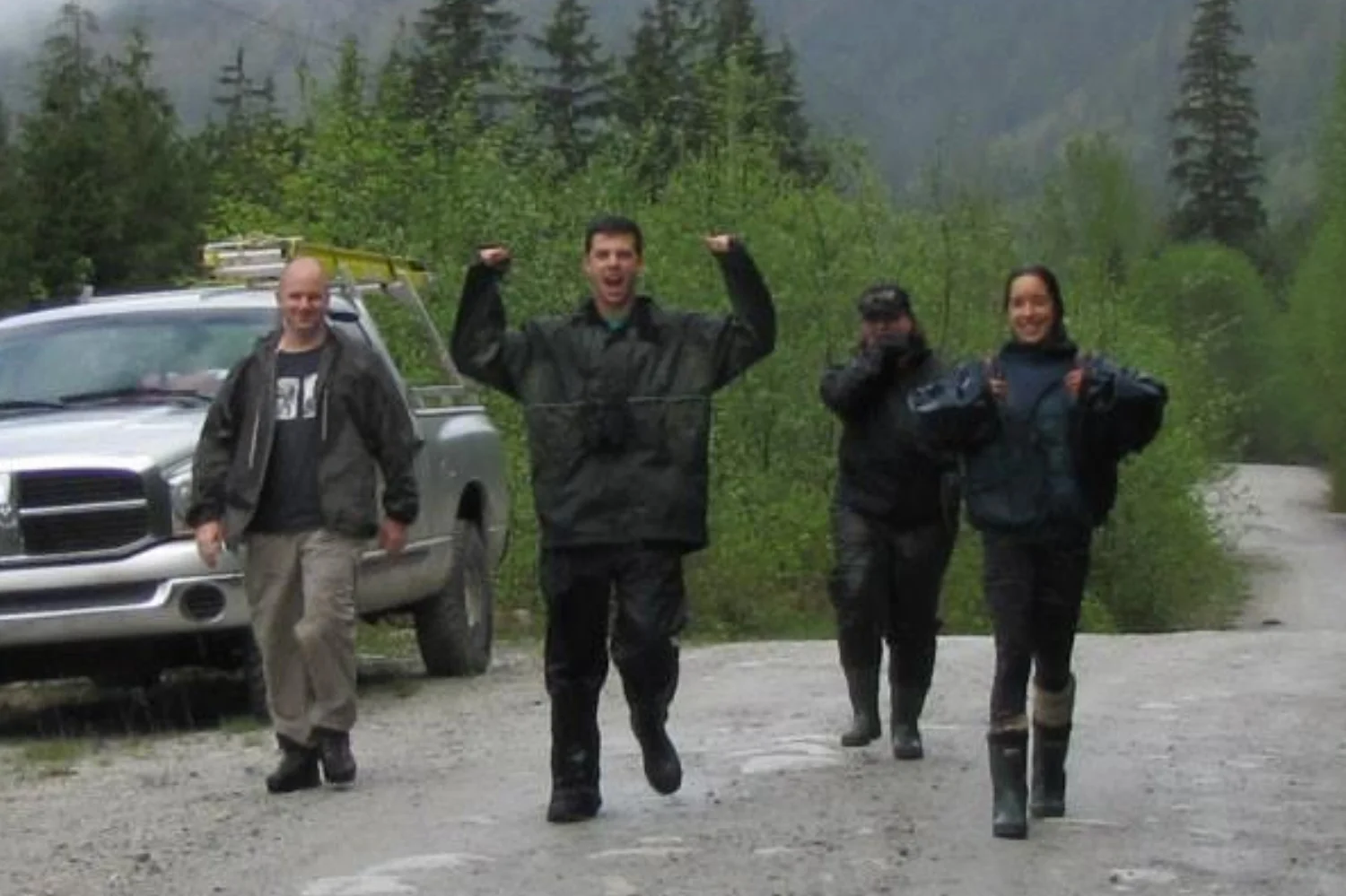 Ecstatic team members celebrate finding a Screech-Owl nest