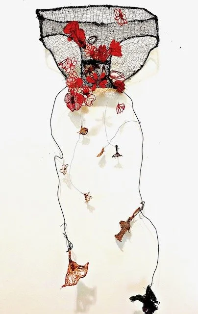 "End of a Manic Episode" 
Wire underwear needle laced by hand with hand embroidered flowers. 15x21x5 Inches.