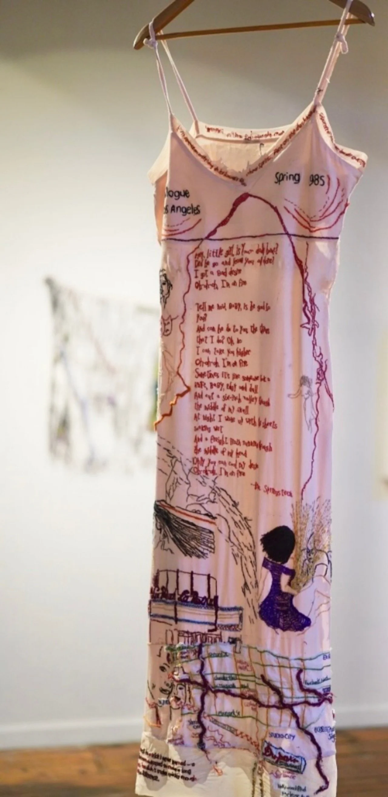 "Prologue: Los Angeles, Spring, 1985 [FRONT]
Hand embroidered on deconstructed cotton blend dress, 18x52x1 inches.