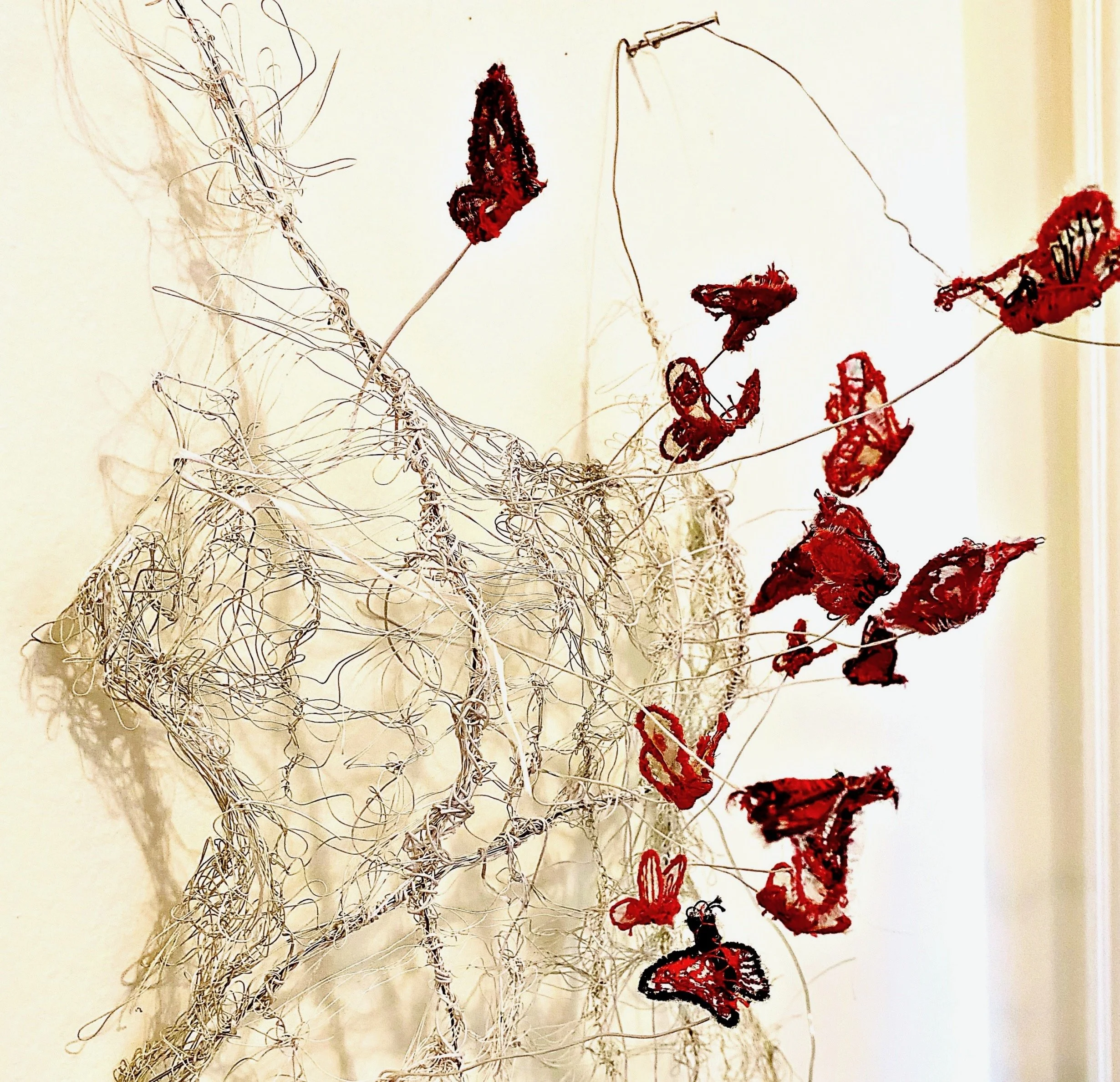 ". . .and her body became butterflies" Wire dress sculpture, hairpin laced by hand with hand embroidered butterflies. 36" x 12" x 5".