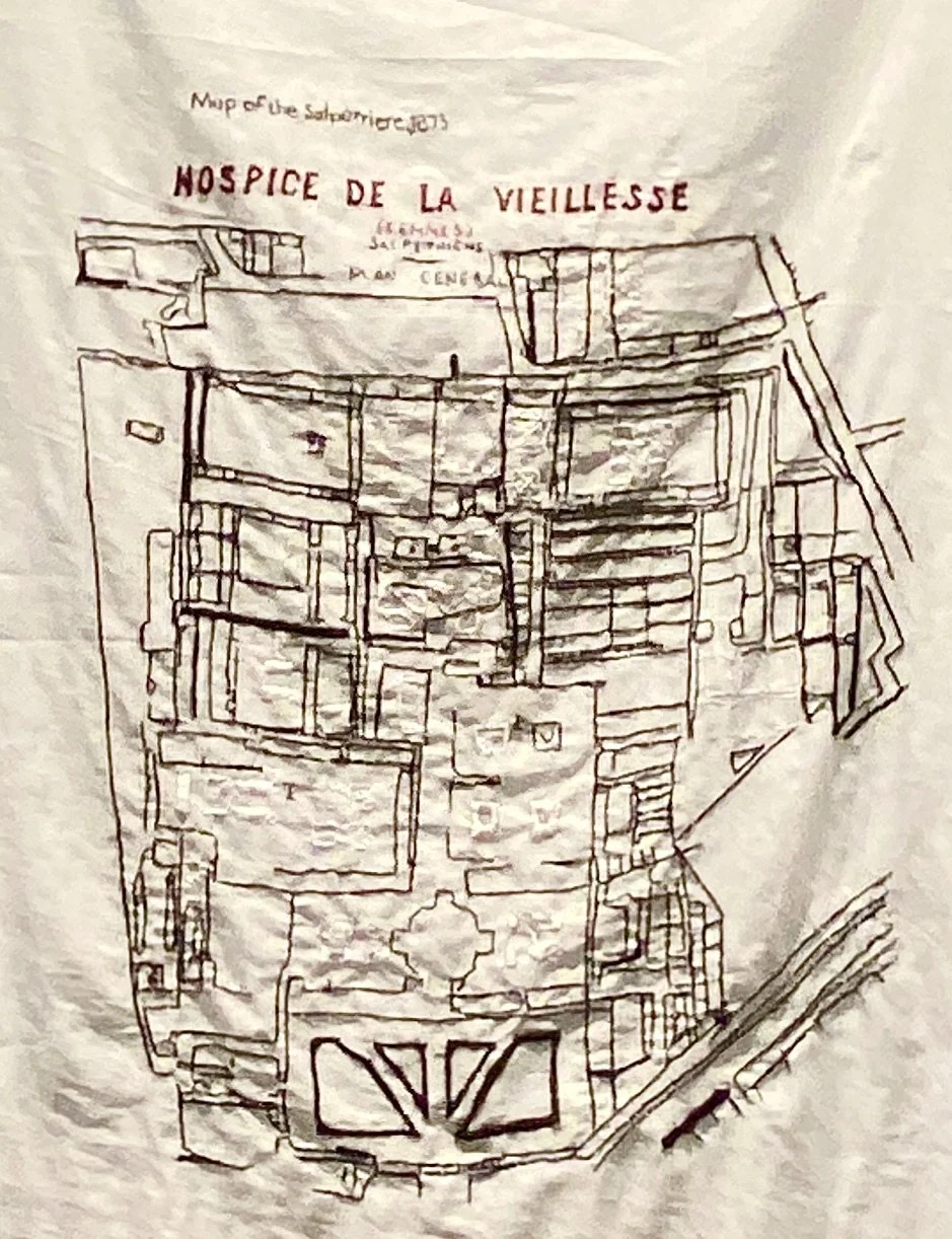 Embroidered textile depicting a map labeled 'Hospice de la Vieillesse' with detailed layout and architectural design.