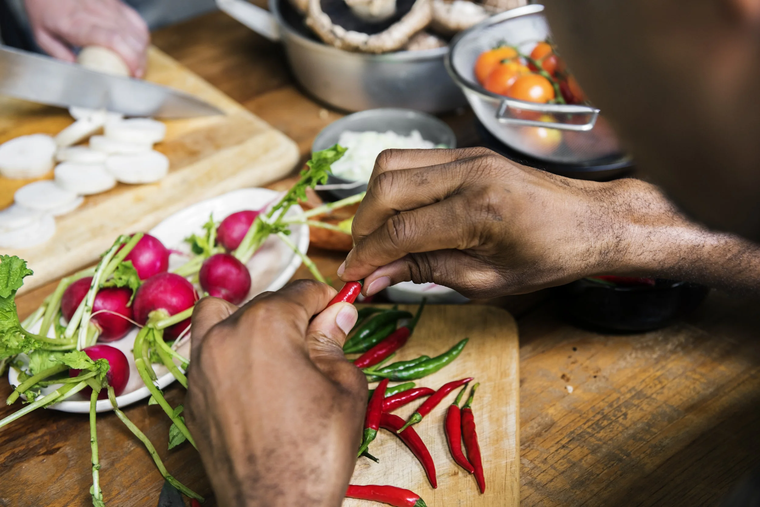 bigstock-Closeup-of-hands-with-chili-pe-192155482.jpg