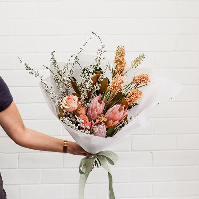 Posy Alert for 27th September | Friday's posy features protea, grevillea, rose, micromyrtus and little gem.⠀
⠀
You can order a single posy for $37, a double posy for $70 or a triple posy for $105, including delivery, and we'll deliver to your door in