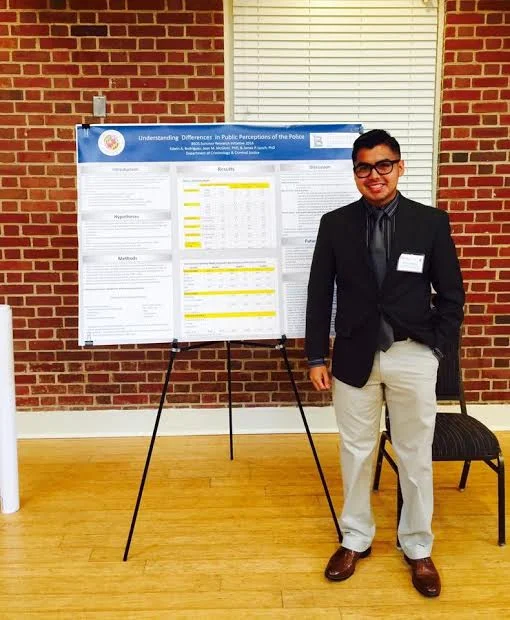 Edwin presenting his research after a summer internship at the University of Maryland, College Park. Tell us a bit about yourself, who was Edwin Rodriguez before becoming a full-fledged professional? I grew up in Montgomery County, Maryland; I’ve lived there my entire life. I attended Bethesda Chevy-Chase High School and graduated from both Montgomery College and the University of Maryland, College Park. I'm of Salvadoran descent; both my parents are from El Salvador. Can you speak about your high school experience? As I mentioned, I went to Bethesda Chevy-Chase High School. My experience there, I think, was a very fortunate one. It’s a very well-funded high school. I had access to both AP and IB courses. I also had access to an organization called College Tracks . Essentially what College Tracks does is help students in high school apply to college and exposes you to the intricacies of life after you get accepted and arrive at college. Do you feel that your time in high school was impacted because you are a first-generation student? Absolutely. The reason I mentioned College Tracks is because I had no idea what the first step to applying to college was even like. I felt very overwhelmed because a lot of my friends had parents who had gone to college and they were going through the process so naturally, I was always too embarrassed to say I don’t even know where to find the application. Can you describe what College Tracks did for you during your college application process? College Tracks helped me with everything regarding the college application process. The first thing they did was ask me what my interests were and where I was thinking of applying. If you had no idea how to answer those questions, they helped you with that too. They helped me write the application essays, fill out the FAFSA for financial aid purposes, and write my resume. Basically, they made sure that my materials were clean and professional. It was definitely a big advantage.