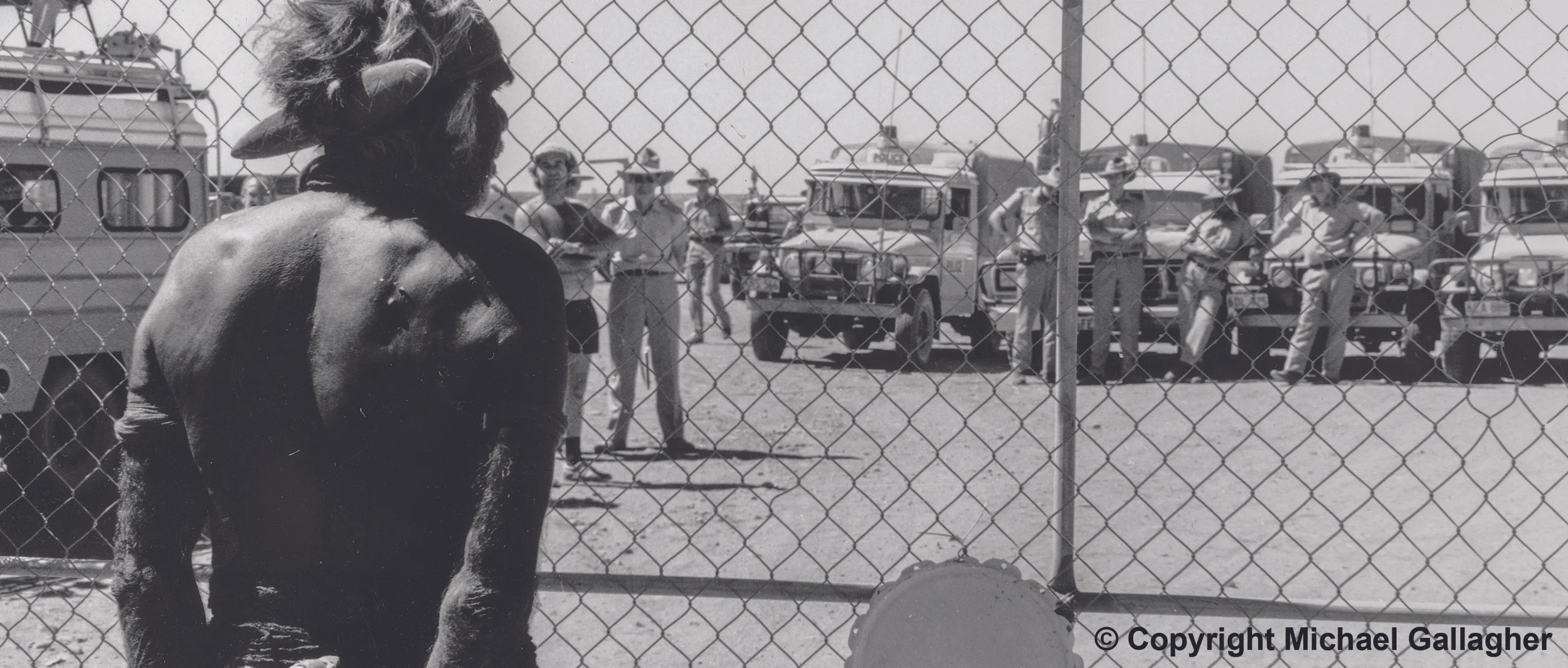 Aboriginal activist Don McLeod led a ceremonial proclamation reclaiming the land and rejecting the legitimacy of the state’s administration of Aboriginal Affairs. Attempts are made to present the proclamation to the police officer in charge of the drill site. Photograph by Michael Gallagher