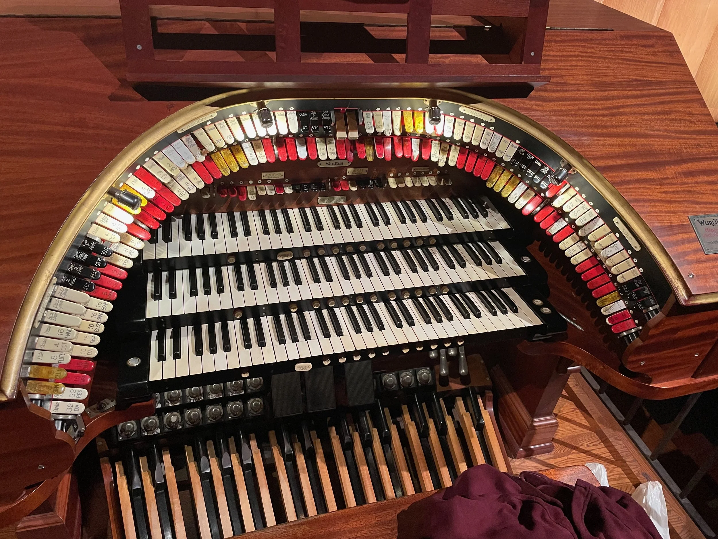 Not sure where this is, but it's a theater organ console (theater organs originally accompanied silent films).