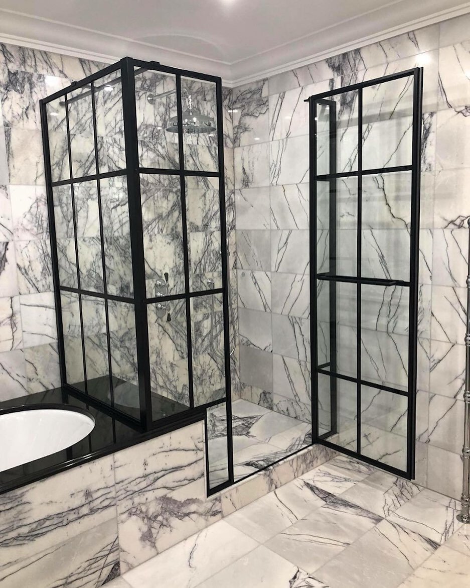 Indulge in the ultimate shower experience with the sleek and sophisticated Drench bespoke shower door in bold black, paired perfectly with the luxurious Samuel Heath shower. Elevate your daily routine and let the cascading water rejuvenate your sense