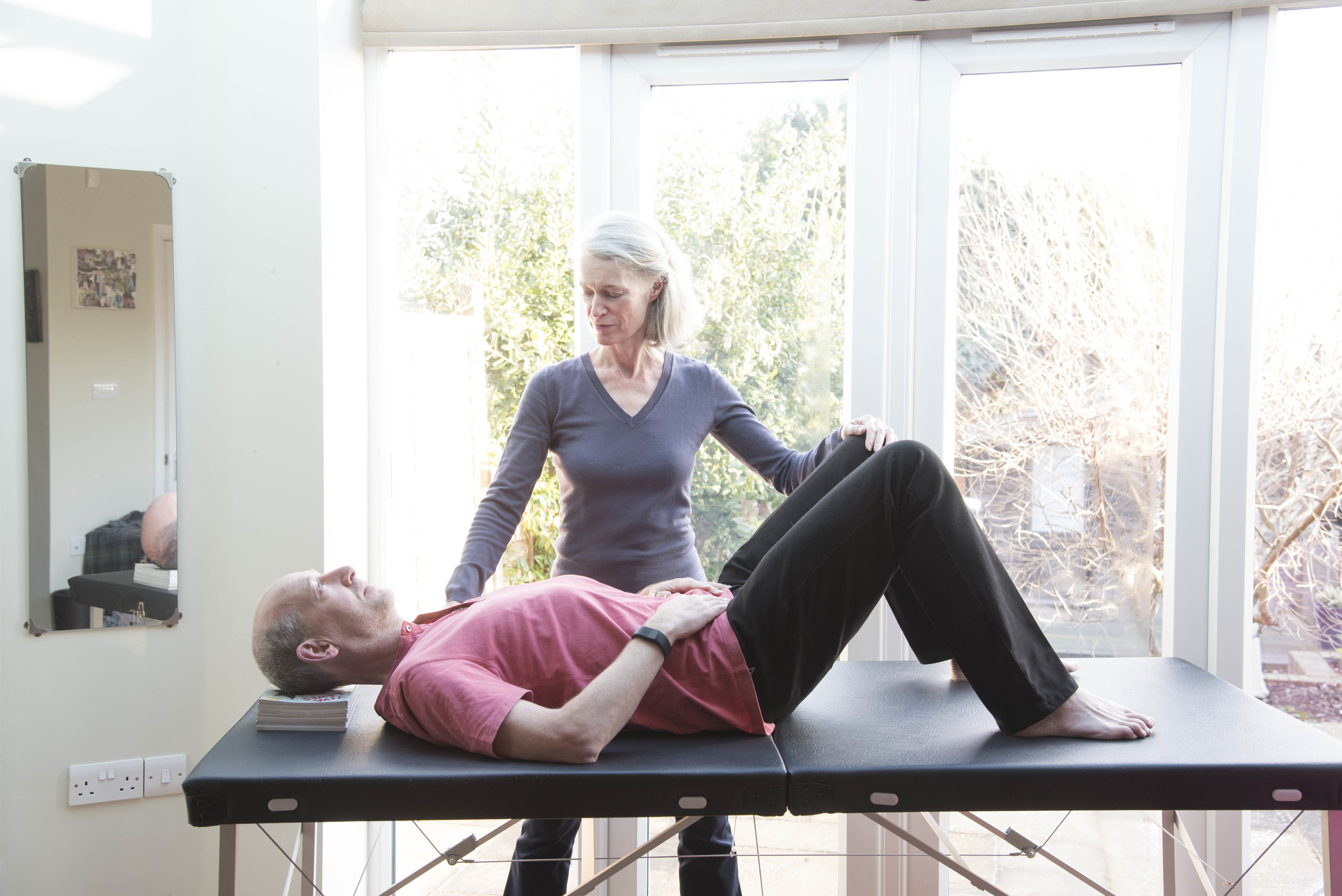 Older woman teaching Alexander Technique to man.jpg