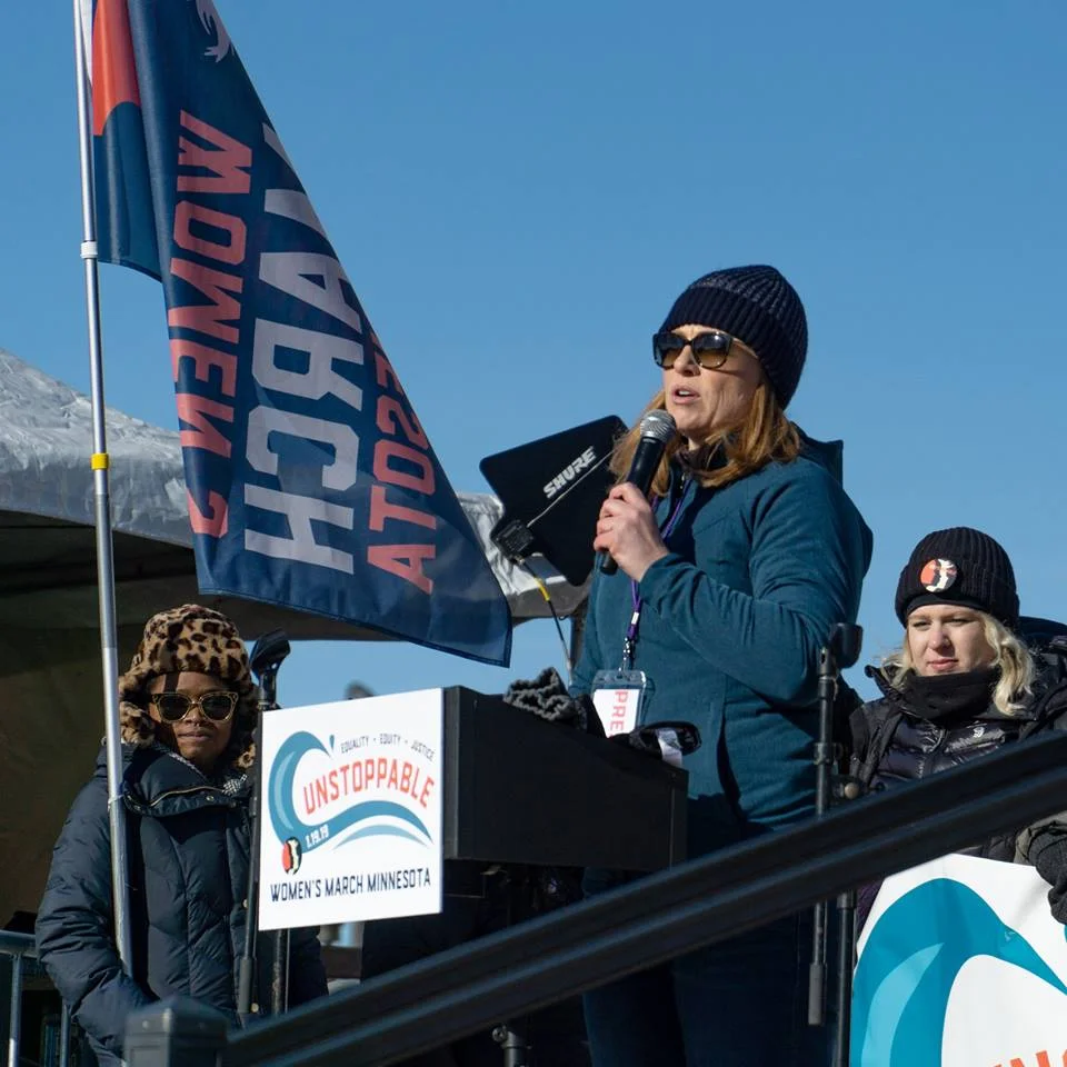 Kara speaking at the MN State Capitol during the 2019 Women’s March // Photo: Sigal Photos