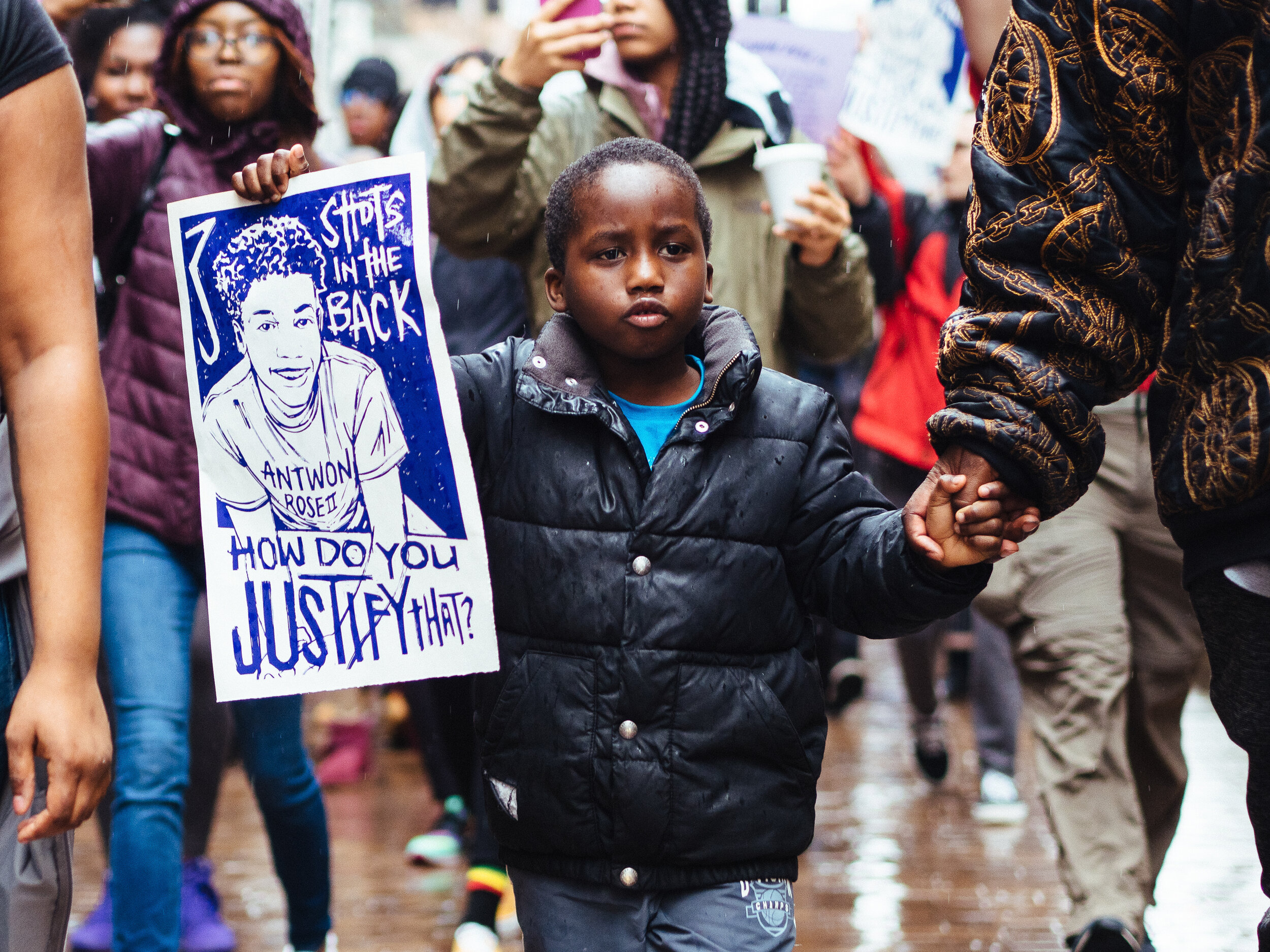  Tymair Johnson, 6, holds a sign as he marches down Grant Street in Downtown Pittsburgh during a student led walkout in remembrance of seventeen year old Antwon Rose II, on Monday, March 25, 2019.   Rose was fatally shot in the back three times by Ea