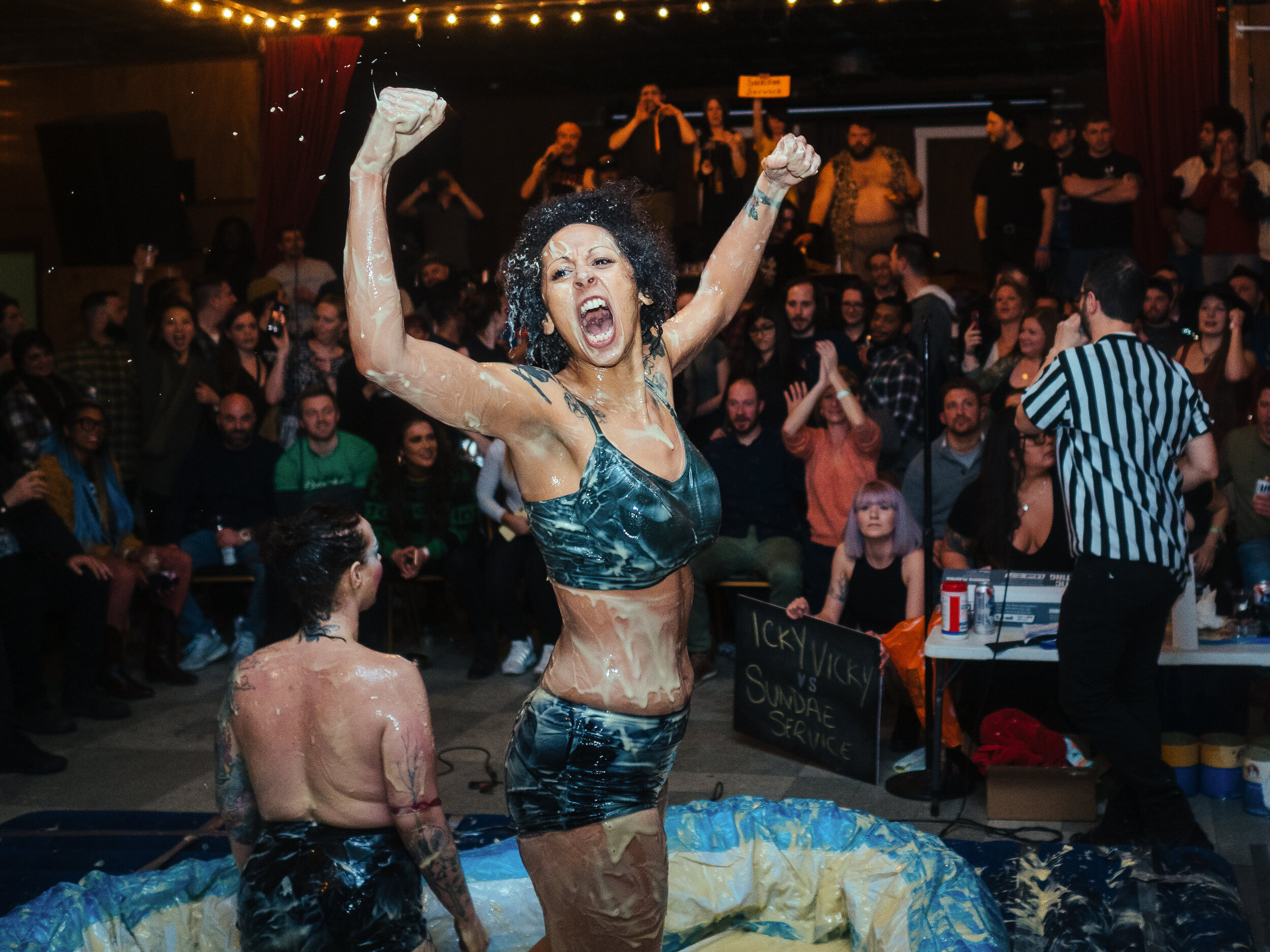 Alicia Lynn, also known as Sundae Service, celebrates after winning a match at the 10th anniversary of Pudding Wrestling Massacre at Spirit in Lawrenceville on Friday, Feb. 15, 2019. 