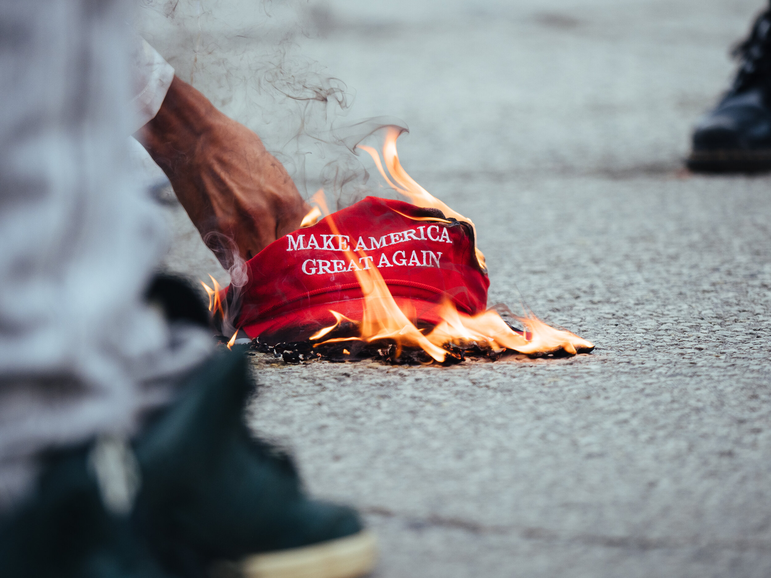  On the ninth Civil Saturdays, held by Black Young and Educated, protest leaders burn a ‘Make America Great Again’ hat and a small American flag taken from an agitator on Saturday, August 1, 2020.  